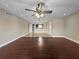 Combination living room featuring hardwood flooring, ceiling fan, tiled entrance and lake views at 626 Orange Dr # 243, Altamonte Springs, FL 32701