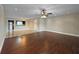 Open-concept living room featuring hardwood floors and a ceiling fan at 626 Orange Dr # 243, Altamonte Springs, FL 32701