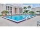 Outdoor pool with plenty of seating and sunshine at 626 Orange Dr # 243, Altamonte Springs, FL 32701