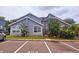 Charming condo with blue siding, white trim, well-maintained landscaping, and designated parking at 658 Caribbean Dr, Davenport, FL 33897