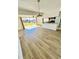 Bright living room with laminate flooring and sliding glass doors leading to the outside at 658 Caribbean Dr, Davenport, FL 33897