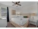 Comfortable bedroom with neutral decor, soft carpet, and a well-lit ambiance for relaxation and rest at 7541 Marker Ave, Kissimmee, FL 34747