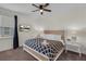 Cozy bedroom features soft lighting, a decorative headboard, and a mounted TV for relaxation at 7541 Marker Ave, Kissimmee, FL 34747