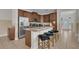 Well-equipped kitchen with a breakfast bar, stainless steel appliances, and ample cabinet space for storage at 7541 Marker Ave, Kissimmee, FL 34747