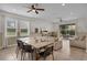 Spacious living room with tile flooring, neutral paint, and ample natural light from large windows at 7541 Marker Ave, Kissimmee, FL 34747