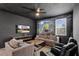 Living room featuring ceiling fan, TV and mural at 7541 Marker Ave, Kissimmee, FL 34747