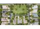 Overhead view displaying community landscaping, surrounding homes, and street layout at 759 Largo Pass, Poinciana, FL 34759