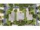 Aerial view of a home showcasing the roof, landscaping, and proximity to nearby streets and houses at 759 Largo Pass, Poinciana, FL 34759