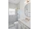Modern bathroom features white vanity, gold fixtures, and glass-enclosed shower at 759 Largo Pass, Poinciana, FL 34759