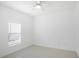 Bright bedroom features a ceiling fan and a window providing natural light at 759 Largo Pass, Poinciana, FL 34759