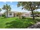 Charming single-story home with a well-manicured lawn and attractive landscaping at 759 Largo Pass, Poinciana, FL 34759