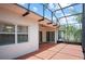 Large screened patio with a brick floor and outdoor living space at 759 Largo Pass, Poinciana, FL 34759