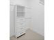 Walk-in closet with built-in shelving, drawers, and hanging rods at 759 Largo Pass, Poinciana, FL 34759