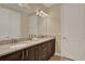 Bathroom featuring double sinks, granite countertops, and walk in shower at 7613 Brookhurst Ln, Kissimmee, FL 34747