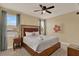 Bedroom featuring a ceiling fan, and a large bed with white linens at 7613 Brookhurst Ln, Kissimmee, FL 34747