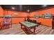 Fun game room with basketball hoop, pool table, and video game consoles at 7613 Brookhurst Ln, Kissimmee, FL 34747