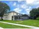 Spacious backyard featuring a screened-in patio and pool area, offering privacy and space for outdoor activities at 7751 Tosteth St, Kissimmee, FL 34747