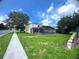 Large backyard showcasing a screened-in patio and pool, providing a perfect oasis for relaxation and recreation at 7751 Tosteth St, Kissimmee, FL 34747