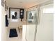 An immaculate bathroom offers a bright, clean space with a glass-enclosed shower and tub for ultimate relaxation at 7751 Tosteth St, Kissimmee, FL 34747