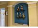 A whimsical nook features a built-in shelf showcasing Disney character figures, adding a touch of playfulness to the space at 7751 Tosteth St, Kissimmee, FL 34747
