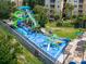 Community water park with slides, splash pads, and play areas for Gathering fun at 7751 Tosteth St, Kissimmee, FL 34747