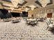 Elegant ballroom featuring a stage, tables, chairs, and a sophisticated design for special events at 777 Glendora Road, Poinciana, FL 34759
