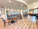 Inviting cafe area with stylish seating, wooden floors, and a relaxed atmosphere at 777 Glendora Road, Poinciana, FL 34759