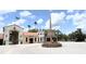 Attractive entrance to Stonegate Golf Club featuring a monument and well-manicured landscaping at 777 Glendora Road, Poinciana, FL 34759