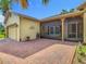 Charming home with a paver driveway, two-car garage and screened-in porch at 777 Glendora Road, Poinciana, FL 34759