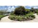 Beautiful flower garden near the lake provides a scenic view and natural beauty at 777 Glendora Road, Poinciana, FL 34759