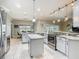Spacious kitchen with granite countertops, stainless steel appliances, and an island at 777 Glendora Road, Poinciana, FL 34759