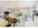 Open kitchen with granite counters, pendant lighting, and a view into the living room at 777 Glendora Road, Poinciana, FL 34759