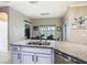 Kitchen island with granite countertops, stainless steel appliances, and a view to the dining area at 777 Glendora Road, Poinciana, FL 34759