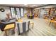 Cozy library with shelves filled with books, comfortable seating, and a quiet ambiance at 777 Glendora Road, Poinciana, FL 34759