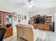Comfortable living room with cozy furniture, ceiling fan, and built-in wooden entertainment center at 777 Glendora Road, Poinciana, FL 34759