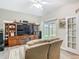 Inviting living room with entertainment center and sliding glass doors leading to outdoor space at 777 Glendora Road, Poinciana, FL 34759
