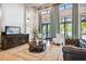 Elegant lobby featuring high ceilings, natural light, and comfortable seating areas with modern decor at 777 Glendora Road, Poinciana, FL 34759