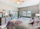 Spacious main bedroom with stylish furnishings, large window, and sliding glass door to patio at 777 Glendora Road, Poinciana, FL 34759
