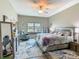 Inviting main bedroom with lots of light, stylish furniture, and serene decor at 777 Glendora Road, Poinciana, FL 34759
