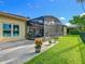 Enjoy the outdoors in this home with a screened-in patio and manicured lawn at 777 Glendora Road, Poinciana, FL 34759