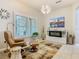Cozy sitting area with modern decor, recliner, and accent lighting at 777 Glendora Road, Poinciana, FL 34759