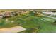 Breathtaking aerial view of a meticulously manicured golf course surrounded by upscale homes at 7802 Palmilla Ct, Reunion, FL 34747