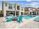Inviting backyard featuring a shimmering pool, stylish lounge chairs, and a cozy fire pit for relaxation at 7802 Palmilla Ct, Reunion, FL 34747