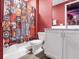 Star Wars themed bathroom featuring a vanity with white cabinets and a shower-tub combo at 7802 Palmilla Ct, Reunion, FL 34747