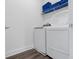 Bright laundry room with front loading washer and dryer and lots of storage space at 7802 Palmilla Ct, Reunion, FL 34747