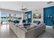 Bright living room with modern decor, fireplace, and views of the pool area at 7802 Palmilla Ct, Reunion, FL 34747