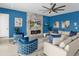 Bright living room with modern furniture, sleek fireplace, and a large television on a custom marble surround at 7802 Palmilla Ct, Reunion, FL 34747