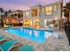 Exterior of home with a private pool and patio area including a grill and seating at 7802 Palmilla Ct, Reunion, FL 34747