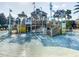 Community splash pad with ladders, slides, platforms, and buckets for Gathering fun at 7802 Palmilla Ct, Reunion, FL 34747