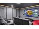 Luxurious theater room with plush seating, a large screen, and surround sound for an immersive experience at 7802 Palmilla Ct, Reunion, FL 34747